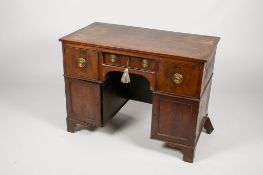 An early 20th century mahogany kneehole twin pedestal desk.