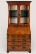A Queen Anne style walnut bureau bookcase.