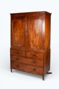 A 19th century mahogany veneered linen press converted into a wardrobe.