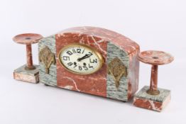 An Art Deco red and grey marble clock garniture.
