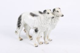 A Sitzendorf porcelain dog group in the form of Borzoi (Russian Wolfhounds). Factory mark to base.