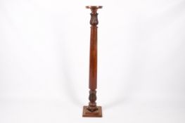 A Victorian carved and turned mahogany torchiere stand.
