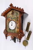 A 19th century Black Forest walnut cuckoo clock.