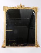 A large 19th century ornate gilt wood and gesso overmantel wall mirror.