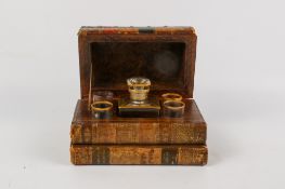 A novelty liqueur set disguised as a stack of leather bound books.