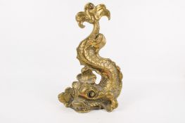 A large 19th century brass doorstop. Modelled as a 'classical' dolphin, H35cm.