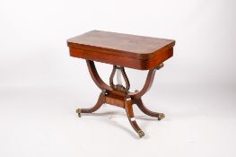 A Victorian mahogany fold top games table.