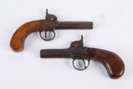 Two percussion pocket pistols.
