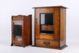 A 20th century oak smoking cabinet and a smaller mahogany cabinet.