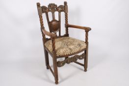 A Victorian oak armchair.