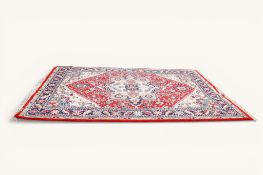 A 20th century large Persian rug.