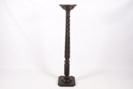 A Victorian carved and turned mahogany torchiere stand.