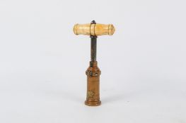 A vintage Thomason type brass mechanical barrel corkscrew.