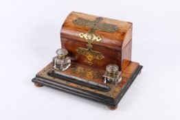 A Victorian brass mounted walnut desktop inkstand.