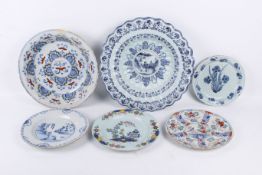 A collection of 18th century Delft dishes and plates.