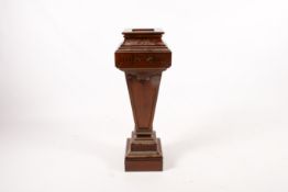 A 20th century Adam style mahogany pedestal.