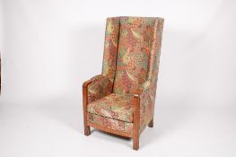 A circa 1940s Parker Knoll high-back wingback upholstered armchair.