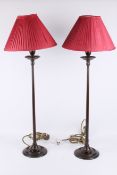 A pair of Arts and Crafts style stained oak table lamps.