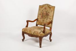 A 19th century carved mahogany open armchair.