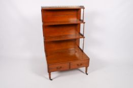A 19th century waterfall type bookshelf display cabinet.
