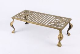 A vintage solid brass trivet stand.
