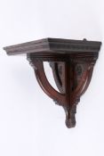 A 20th century aesthetic movement oak wall bracket.