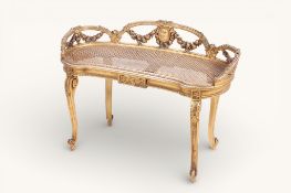 An early 20th century giltwood kidney-shaped stool or window seat.