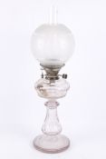 A Victorian cut glass oil lamp.