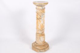 A marble cylindrical pedestal column stand with ringed detail.