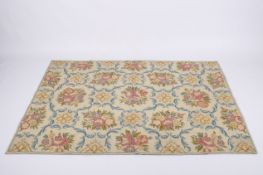 A pair of early 20th century crewel work wall hangings or rugs.