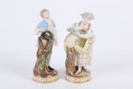 A pair of late 19th century Meissen porcelain figures.