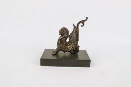 A bronze model of a mythological animal.