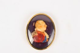 A miniature coloured wax portrait plaque of George III.