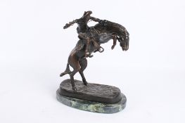After Frederic Sackrider Remington (American, 1861-1909), 'The Bronco Buster', patinated bronze.