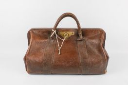 A vintage Gladstone brown leather bag.