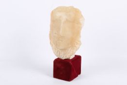 A carved alabaster head.