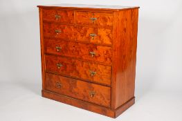 A late Victorian varnished pitch pine chest of drawers.