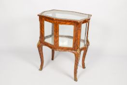 A 19th century French rosewood and gilt metal mounted bijouterie table display cabinet.