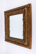 A 20th century gilt framed wall mirror.