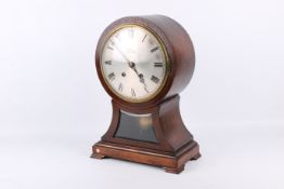 A late 19th century mahogany balloon cased mantel clock.