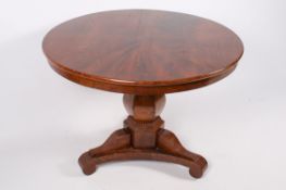 A Victorian mahogany single pedestal centre table with a scrolled tri-base.