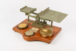 A set of early 20th century brass postal scales.