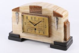 An Art Deco marble mantel clock, with later mechanism.