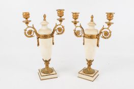 A pair of French gilt bronze and white marble candelabra.
