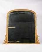 A Victorian gilt and gesso framed overmantel mirror with a later plate.
