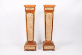A pair of 20th century wooden pedestals.