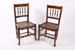 A pair of 19th century oak dining chairs.