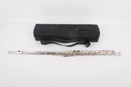 A Trevor James of London TJ10X flute. Model 3001, with fitted case and purchase card.