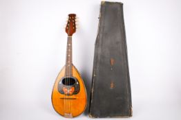 A 20th century bow back Neopolitan mandolin and case.