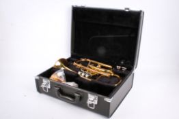 A Yamaha cornet, cased. Model YCR2330 II, S/n 409635. With accessories in the case.